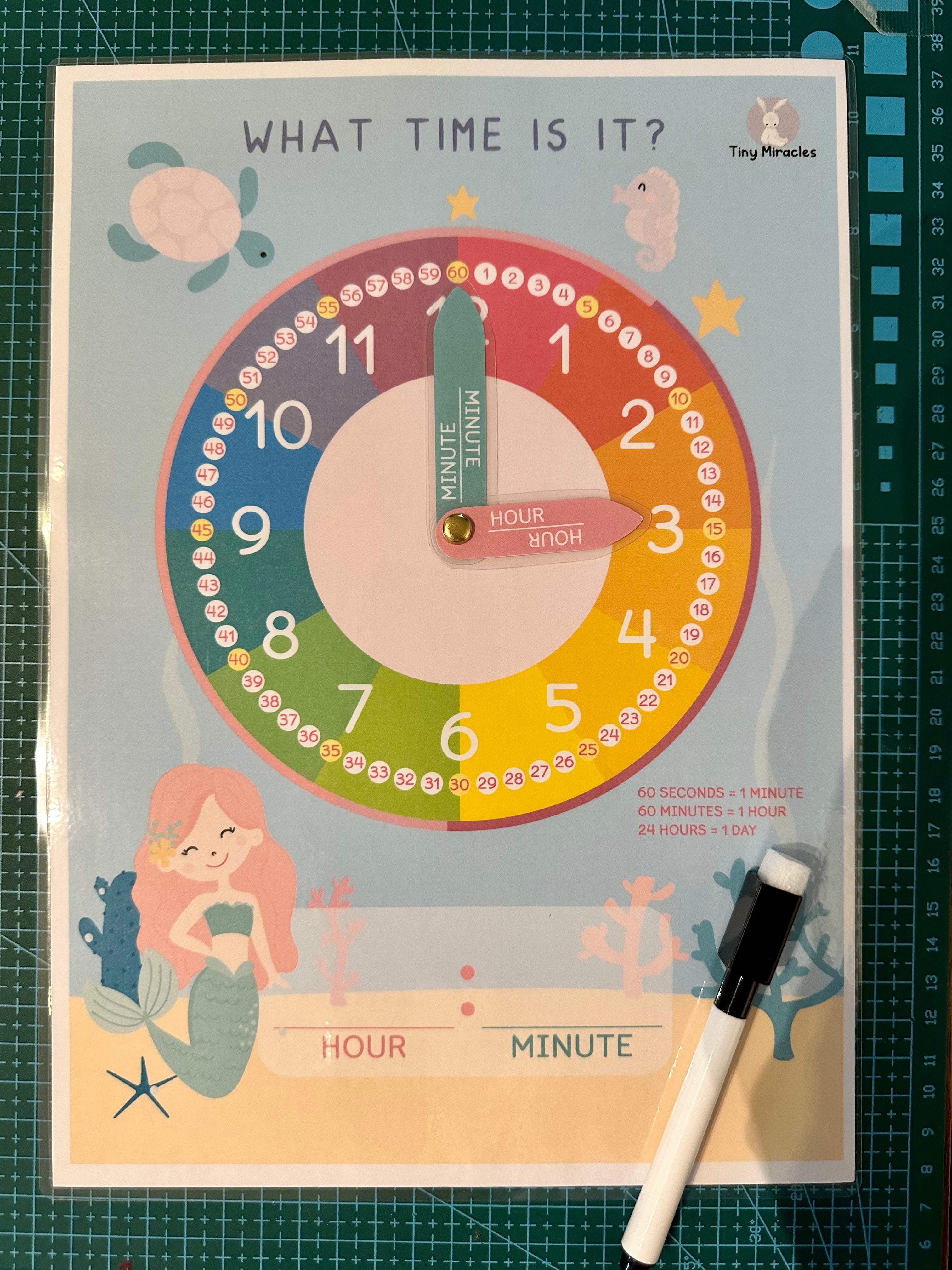 Educational clock poster for learning time with a mermaid design 