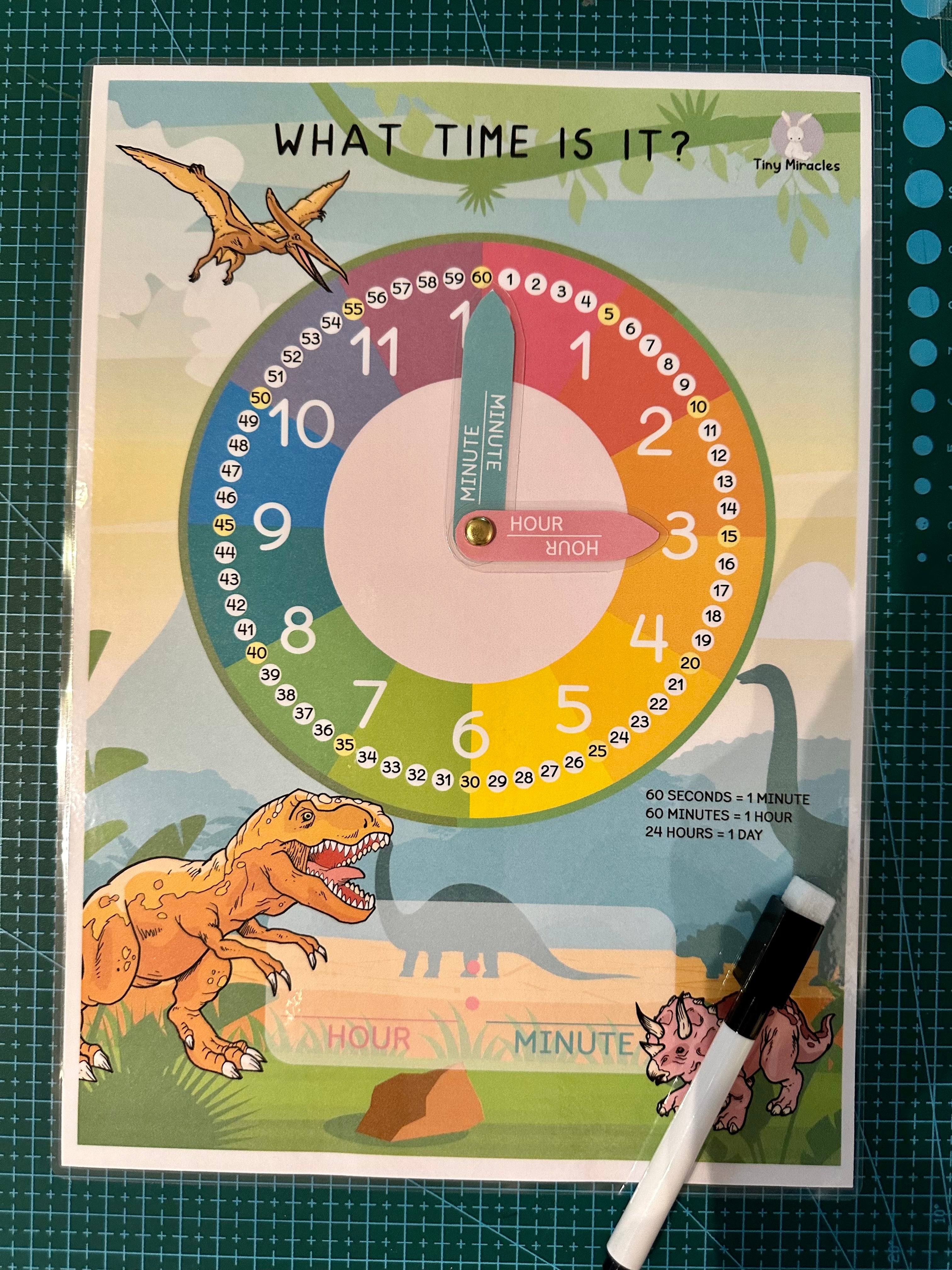 Educational clock poster with dinosaurs on a green grid background