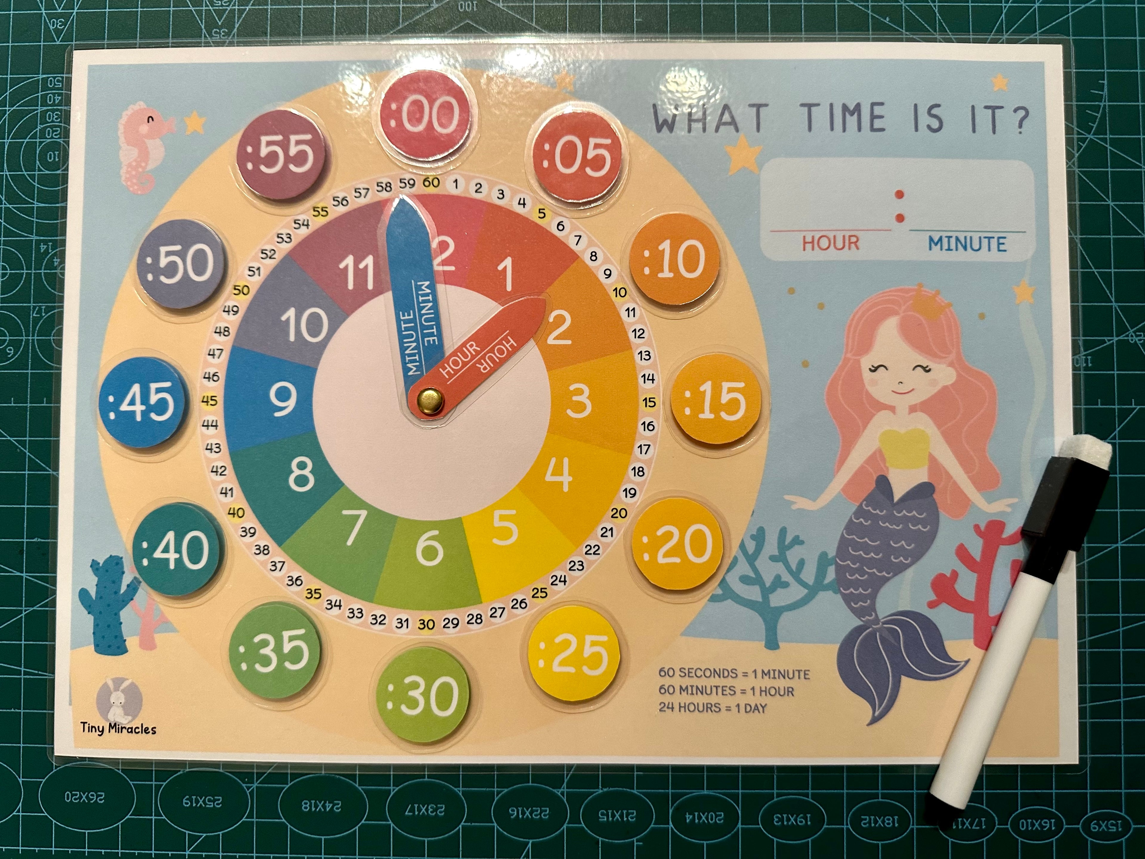 Educational clock with mermaid design 
