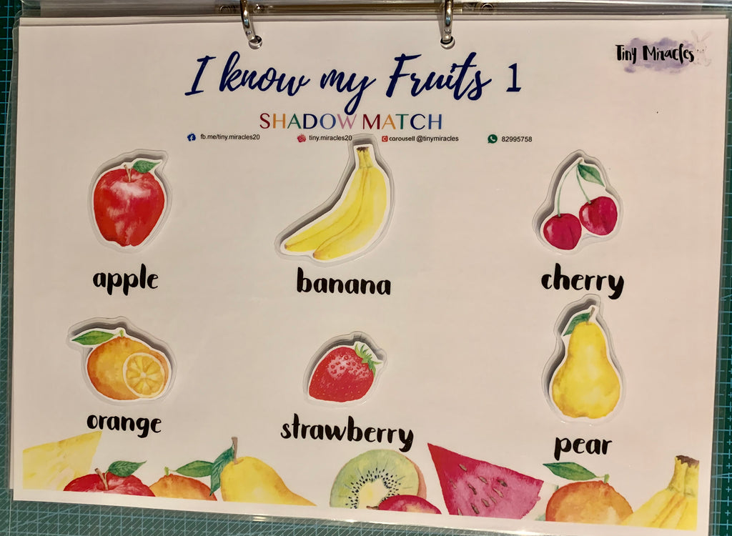 Educational children's book with fruit illustrations and labels on a white background.