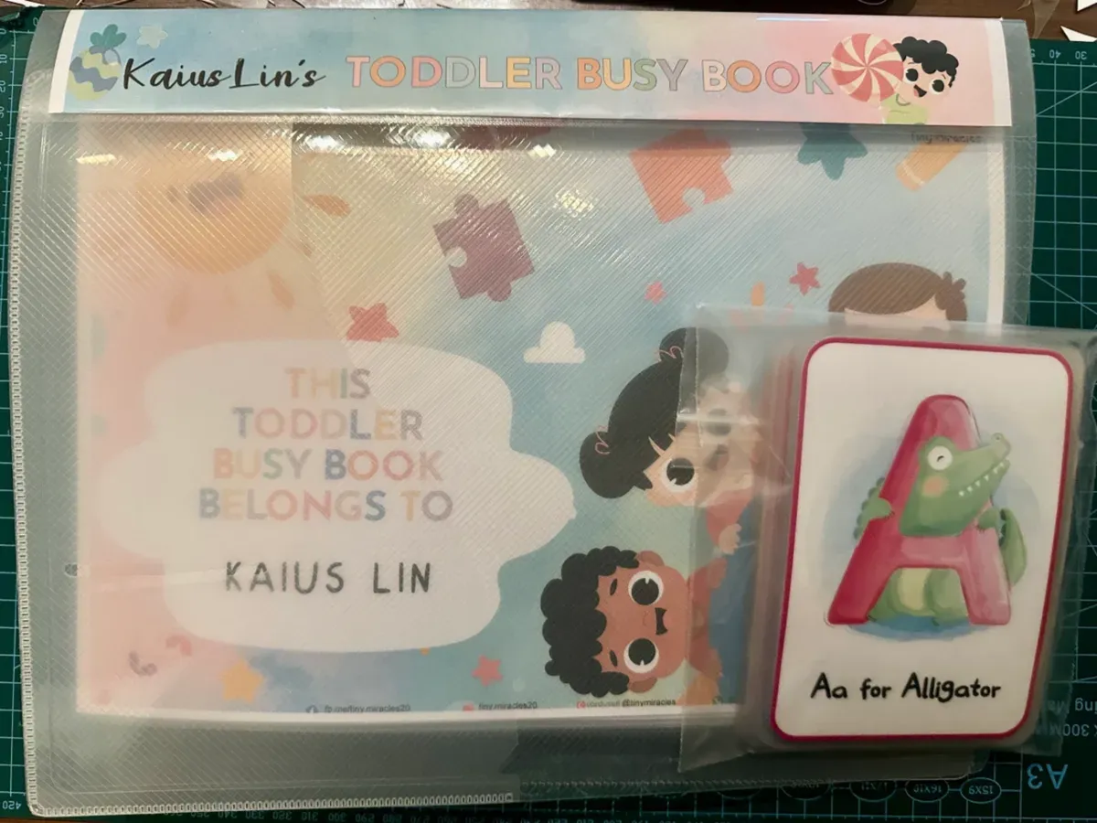 Toddler Busy Book with the ABC Flash card showing 'Aa for Alligator'