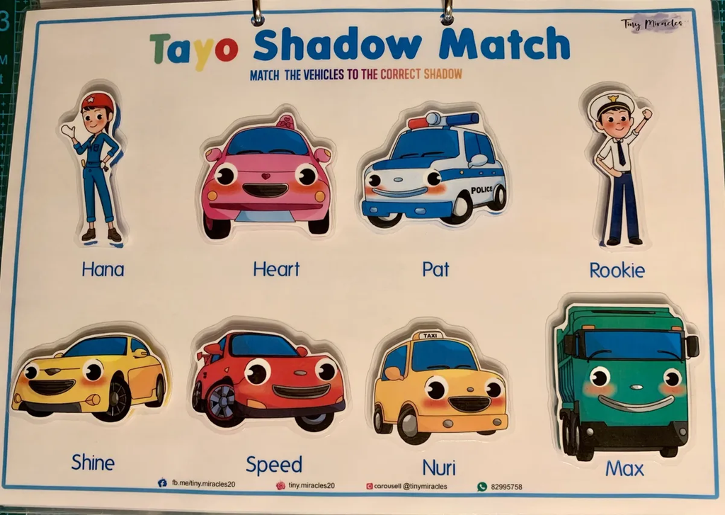 Tayo Shadow Match game with cartoon characters and vehicles on a blue background