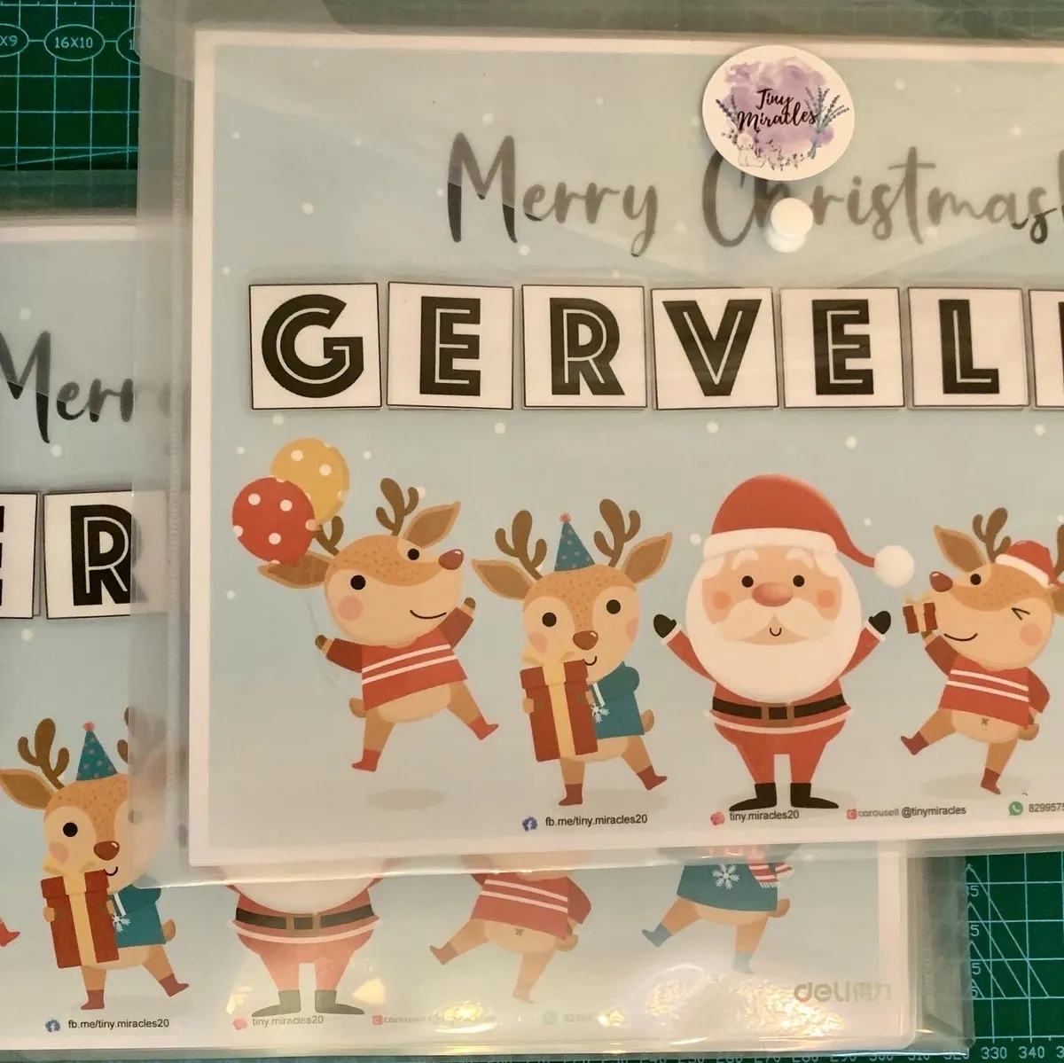 Christmas-themed clear stamp set with Santa and reindeer design on a white background.